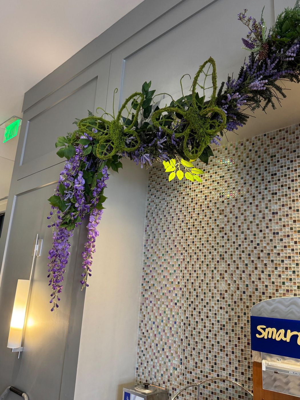 Cascading wisteria and moss-butterfly corner garland
