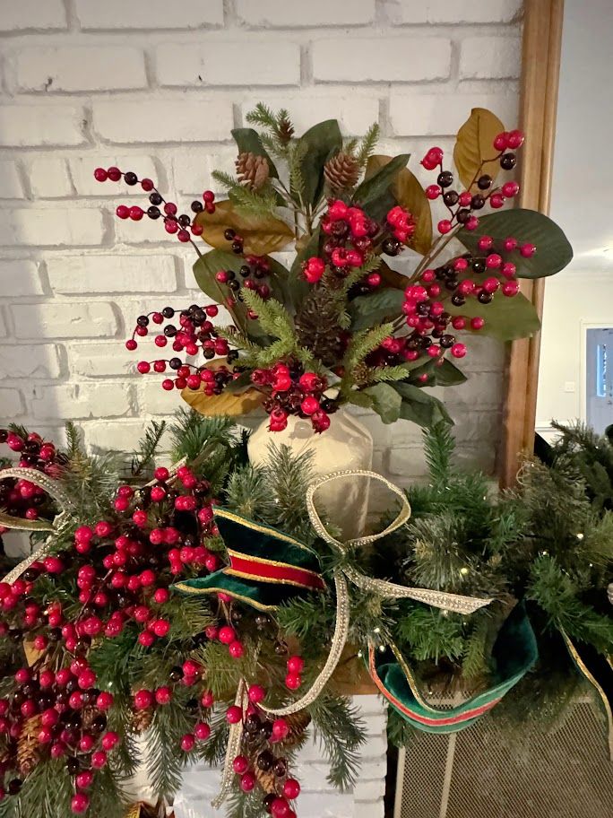 Red berry, magnolia and ribbon mantel detail